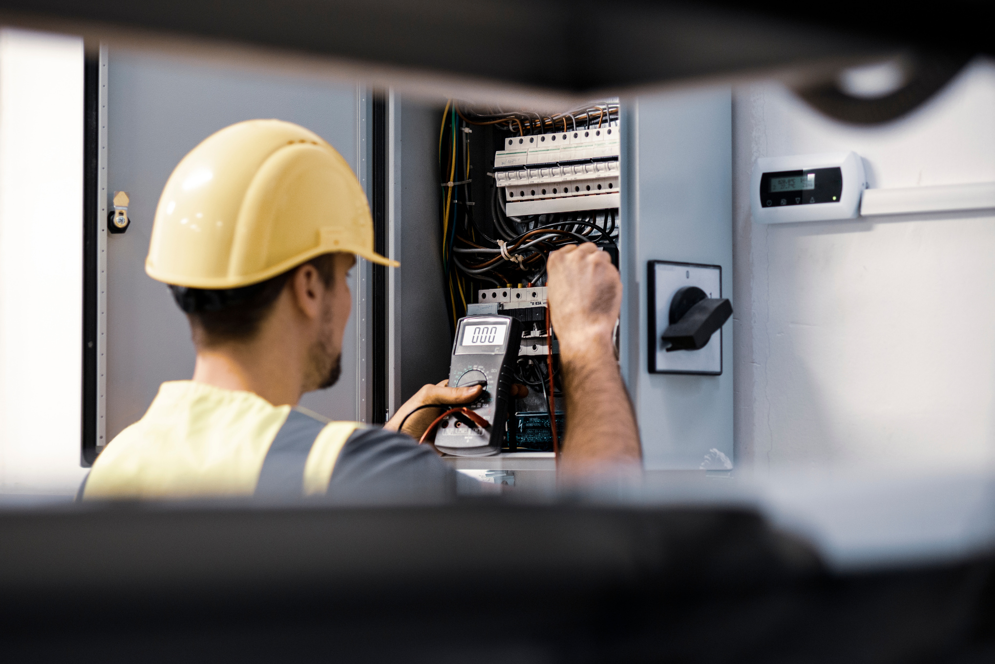 Electrician repairing electric panel